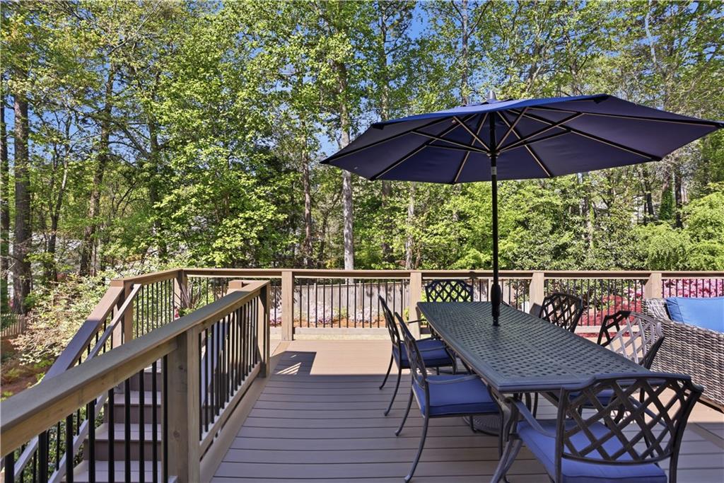 4662 Gilhams Road Roswell, GA 30075 - Photo 15 of 71 a view of balcony with outdoor seating and wooden floor