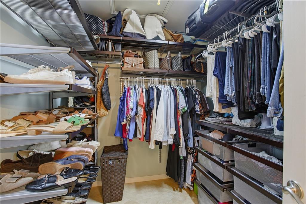 4662 Gilhams Road Roswell, GA 30075 - Photo 33 of 71 a view of walk in closet with clothes and shoes