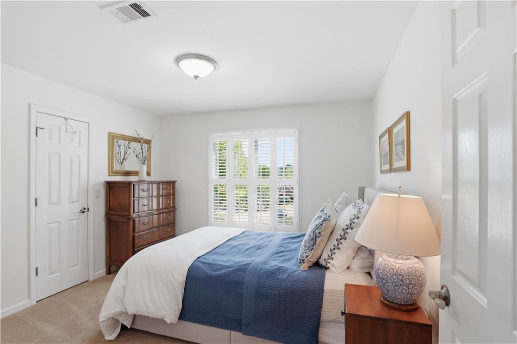 4662 Gilhams Road Roswell, GA 30075 - Photo 36 of 71 a bedroom with a bed and a window