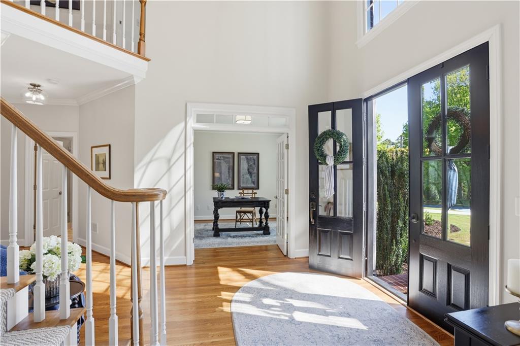 4662 Gilhams Road Roswell, GA 30075 - Photo 4 of 71 a view of an entryway with wooden floor and windows