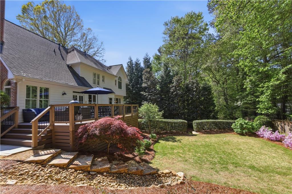 4662 Gilhams Road Roswell, GA 30075 - Photo 62 of 71 a view of a house with backyard and sitting area