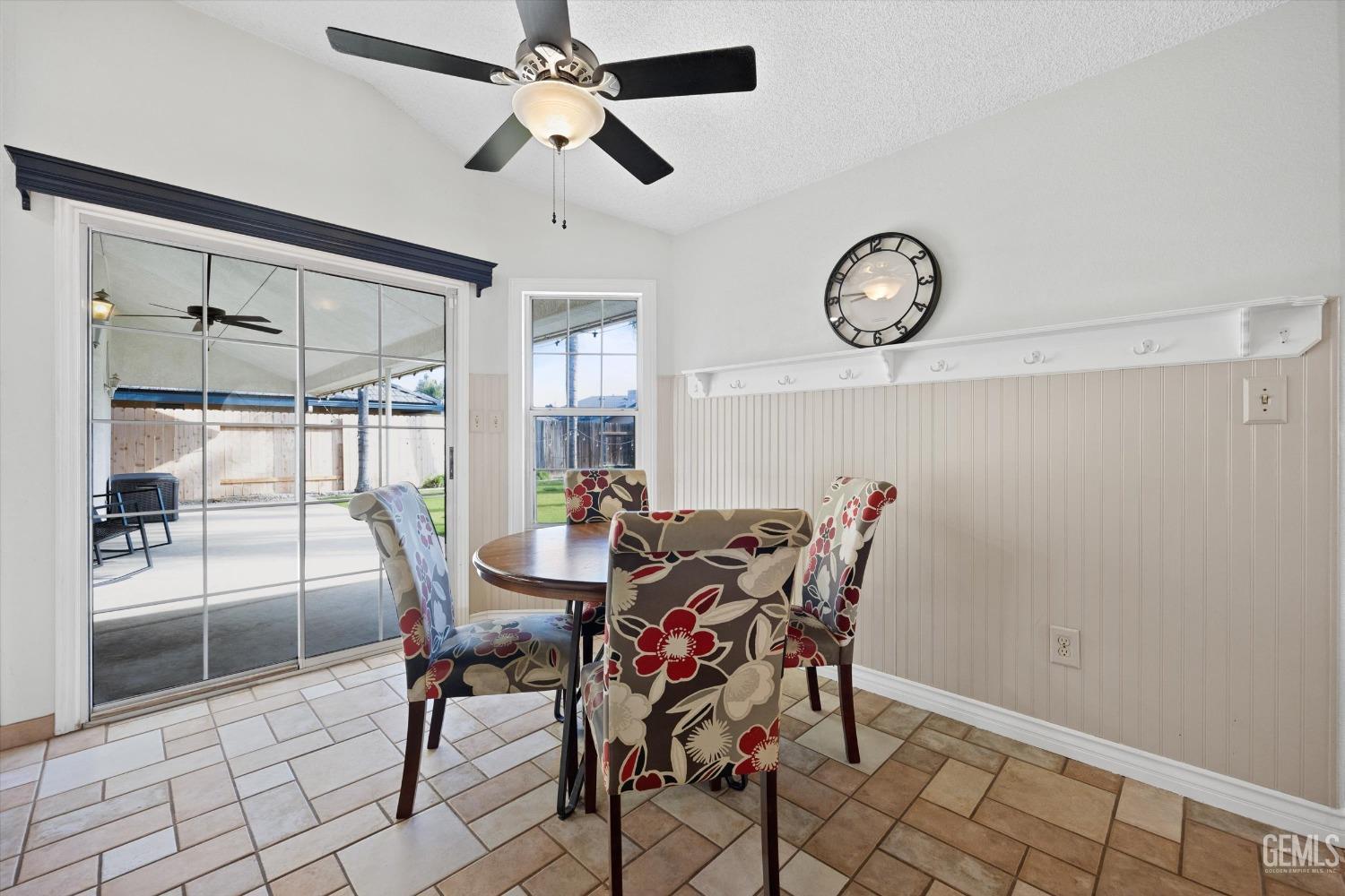 Undisclosed Address Bakersfield, CA 93308 - Photo 18 of 48 a view of a dining room with furniture and a large window