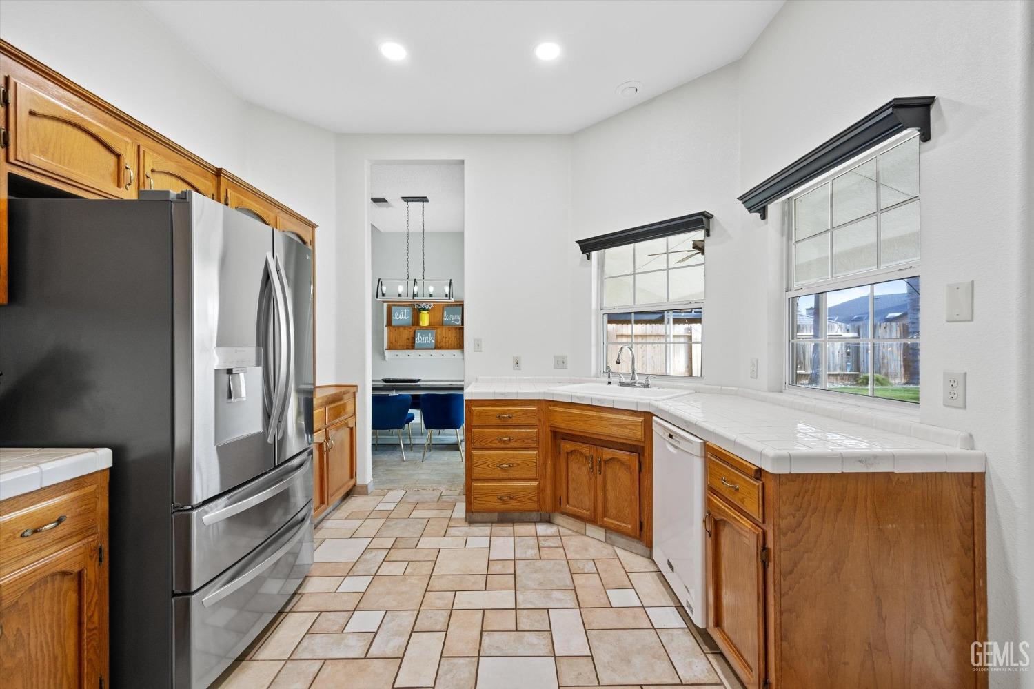 Undisclosed Address Bakersfield, CA 93308 - Photo 23 of 48 a kitchen with stainless steel appliances granite countertop a refrigerator and a sink
