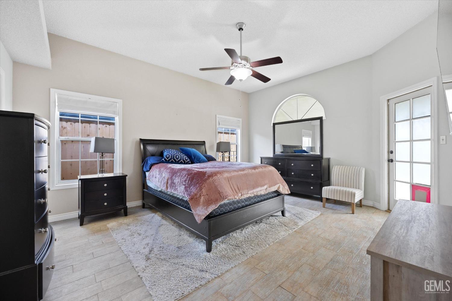 Undisclosed Address Bakersfield, CA 93308 - Photo 24 of 48 a bedroom with a bed couch and window