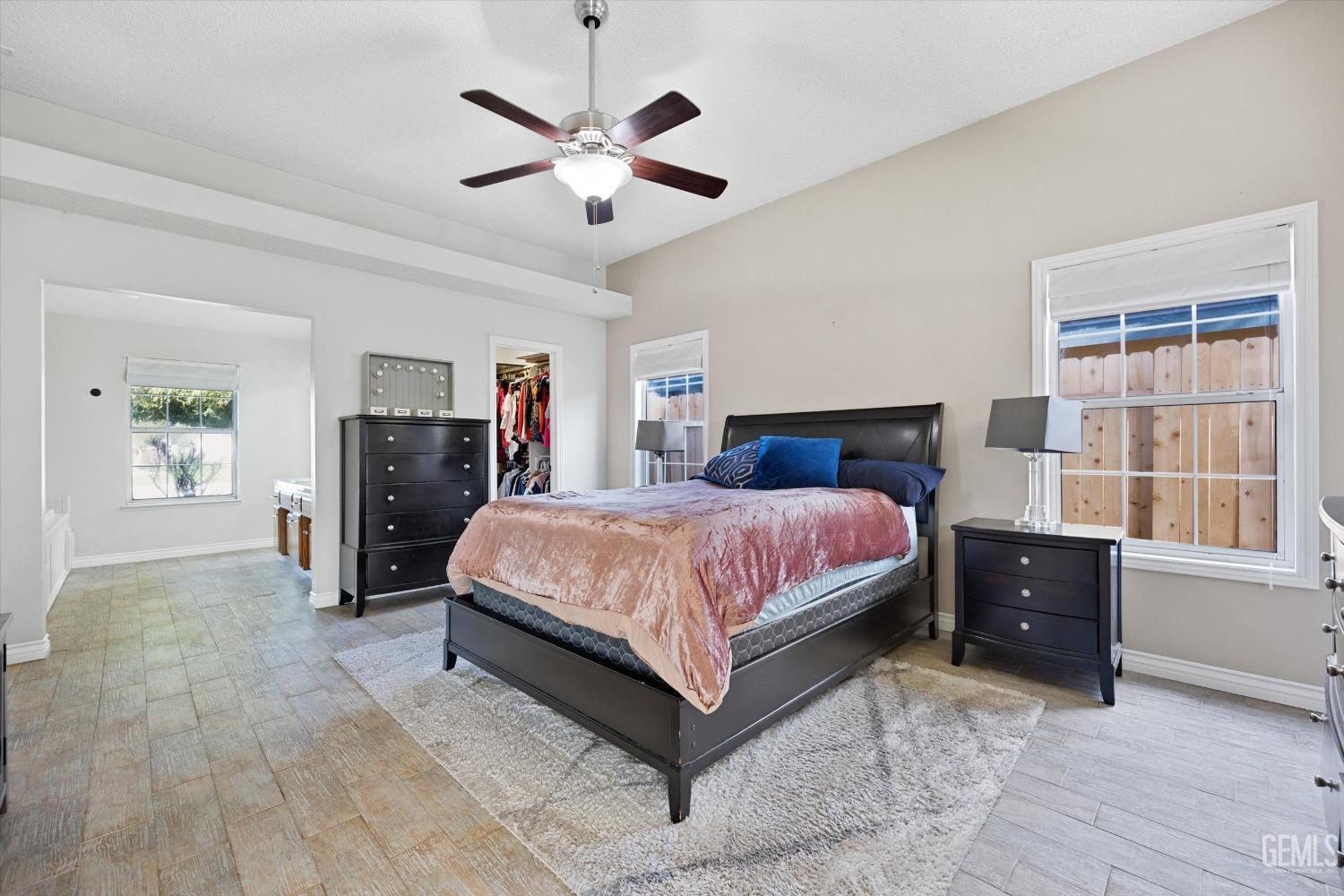 Undisclosed Address Bakersfield, CA 93308 - Photo 25 of 48 a bedroom with a large bed and a tv