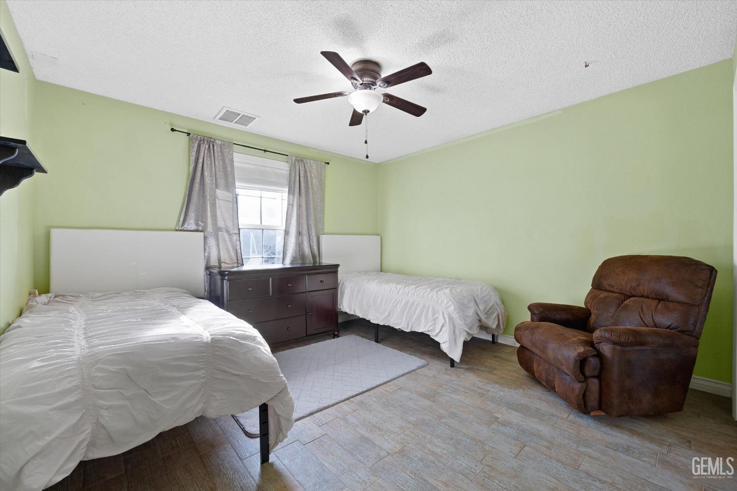 Undisclosed Address Bakersfield, CA 93308 - Photo 29 of 48 a bedroom with bed and window