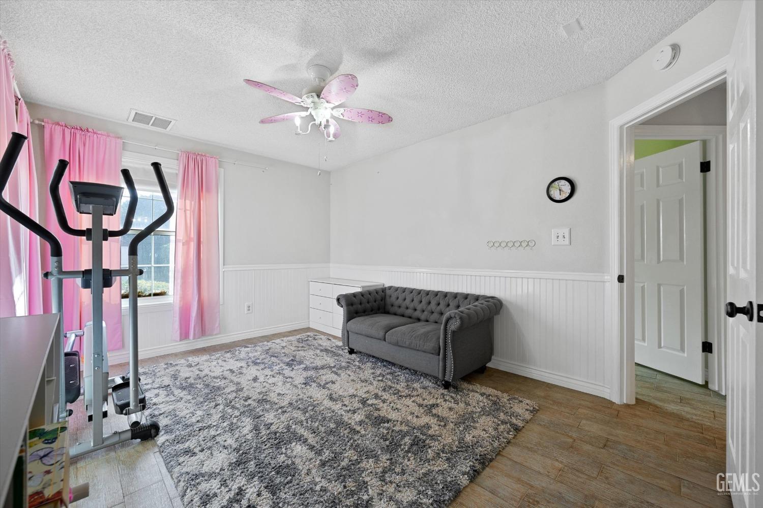 Undisclosed Address Bakersfield, CA 93308 - Photo 32 of 48 a living room with furniture and a chandelier