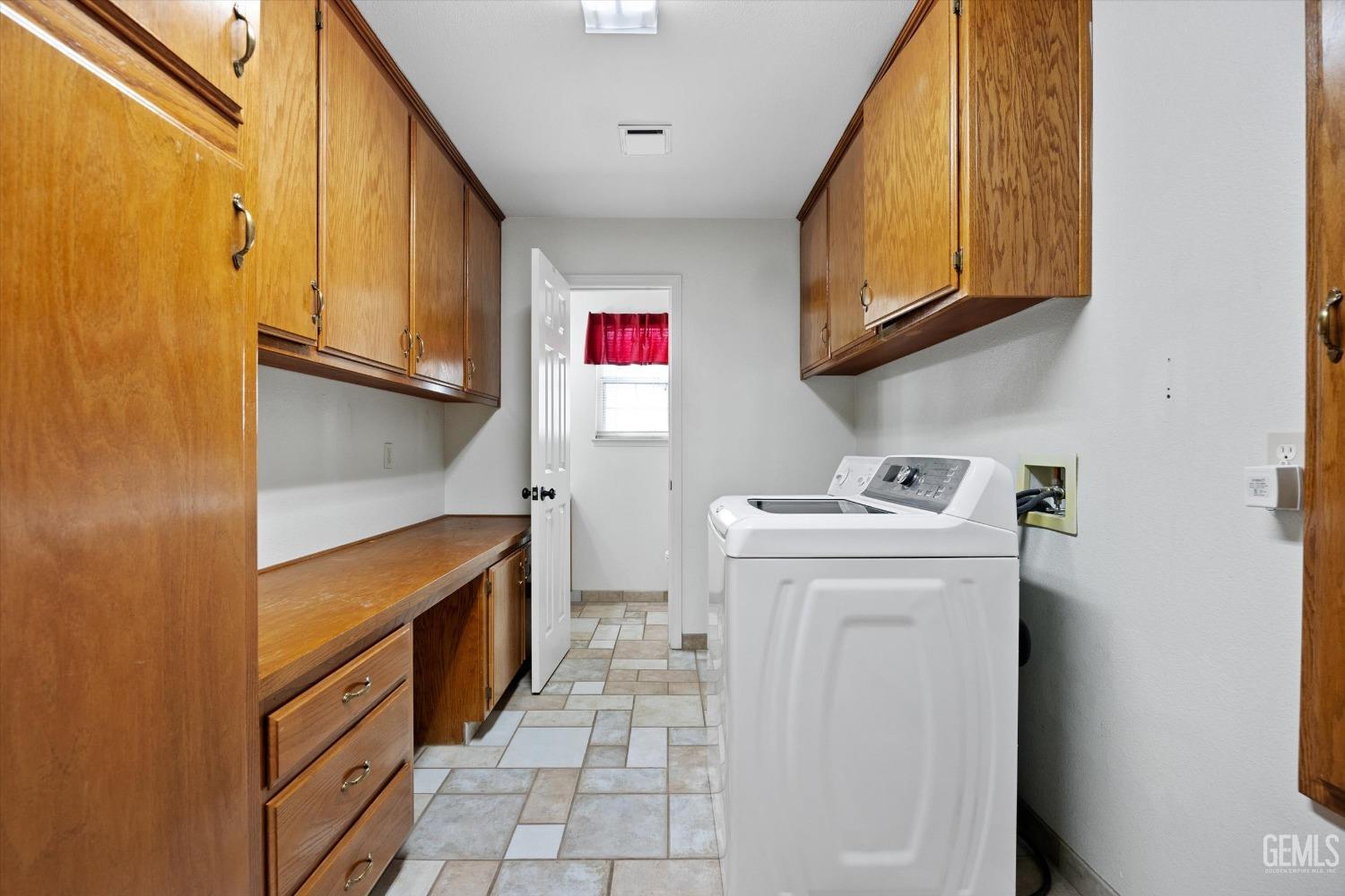 Undisclosed Address Bakersfield, CA 93308 - Photo 37 of 48 a utility room with dryer and washer