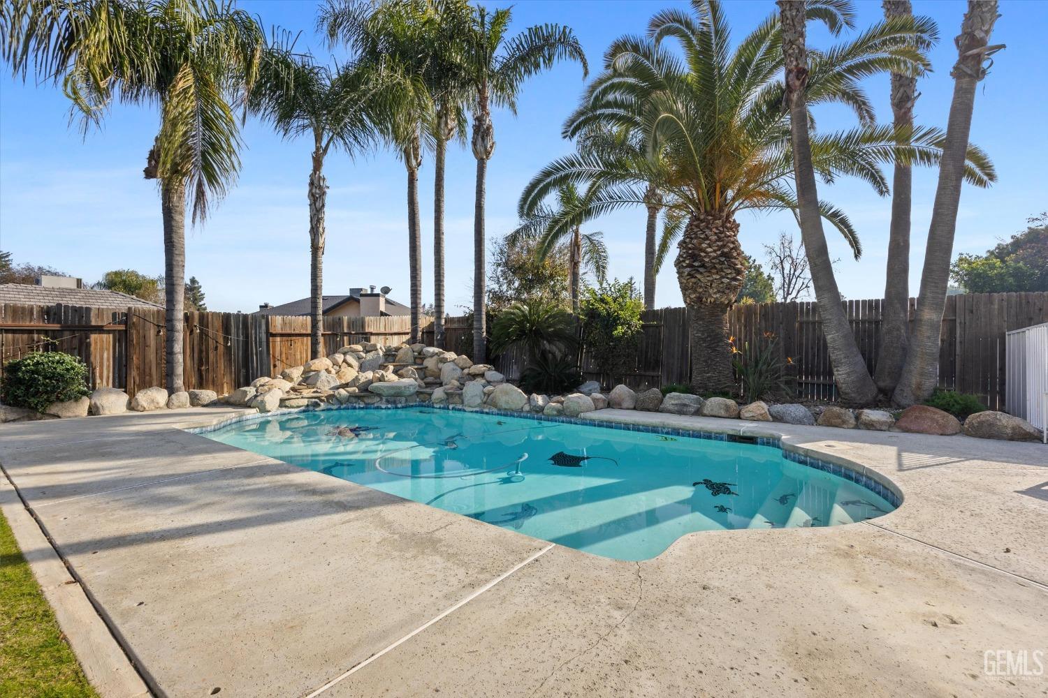 Undisclosed Address Bakersfield, CA 93308 - Photo 38 of 48 a view of a backyard with palm trees
