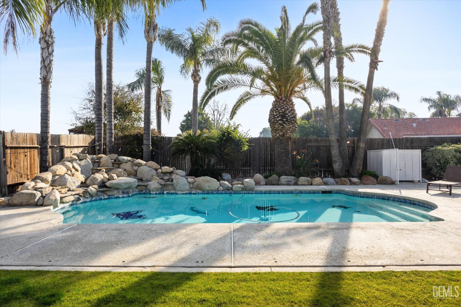 Undisclosed Address Bakersfield, CA 93308 - Photo 39 of 48 a view of a backyard with swimming pool