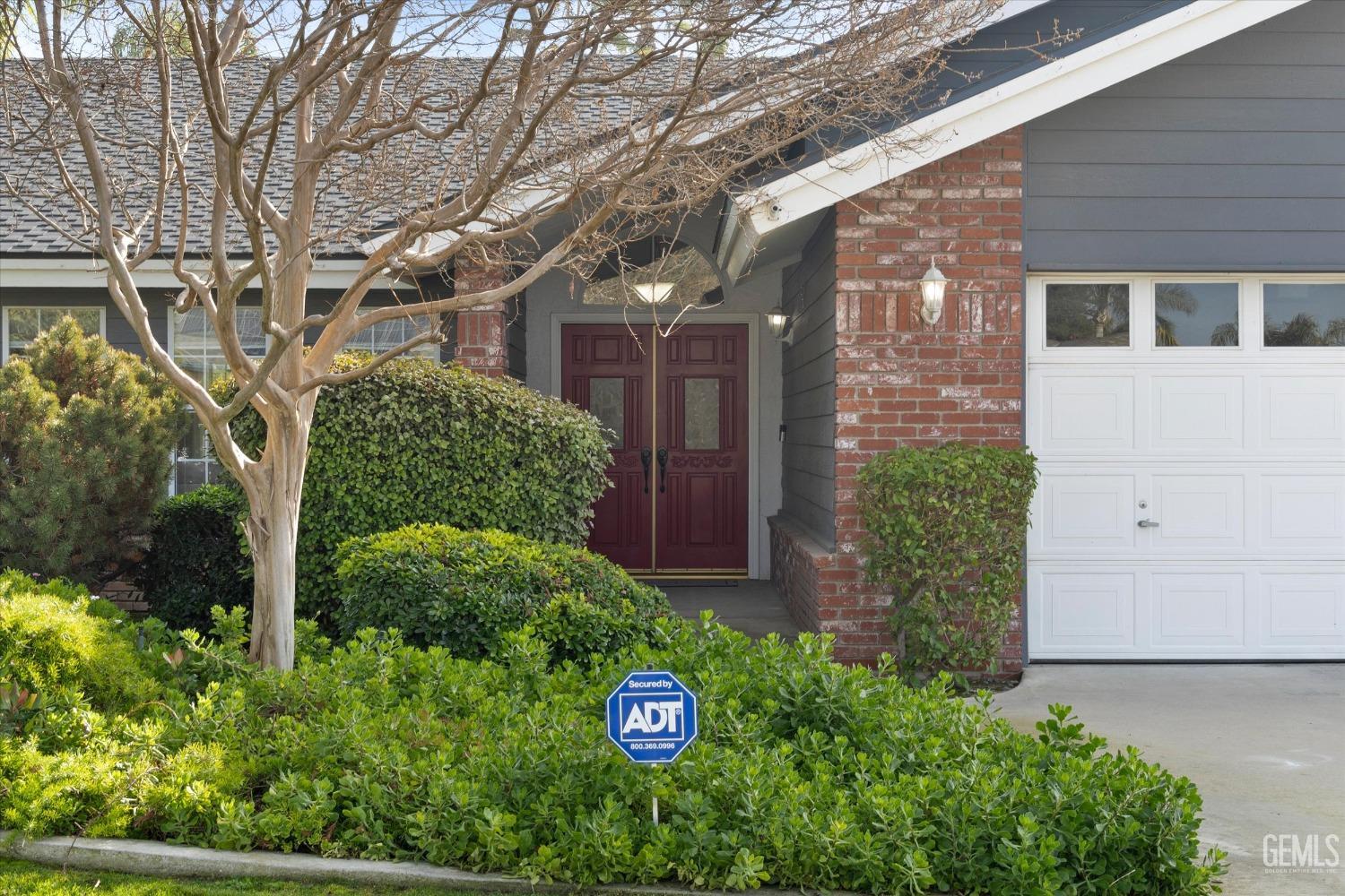 Undisclosed Address Bakersfield, CA 93308 - Photo 4 of 48 a front view of a house with a yard
