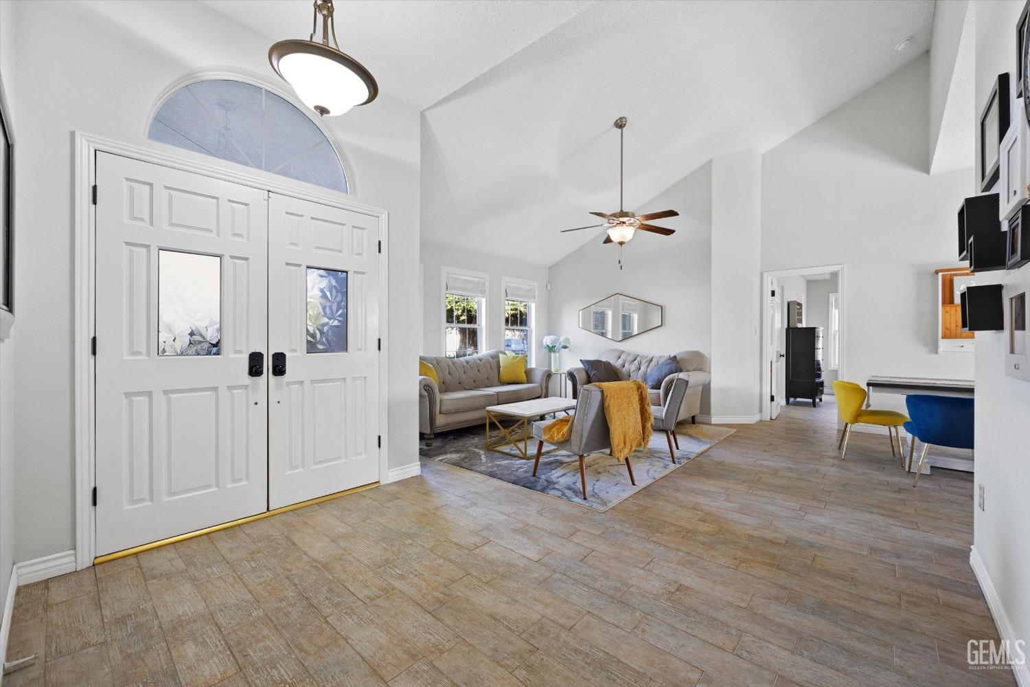 Undisclosed Address Bakersfield, CA 93308 - Photo 6 of 48 a view of a livingroom with furniture and a ceiling fan