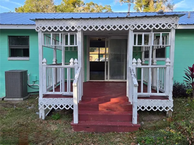 a view of front door of house with outdoor