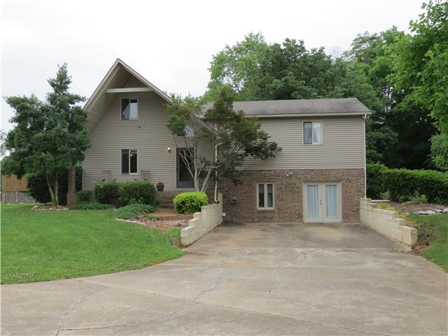2255 Thompson Road Murfreesboro, TN 37128 - Photo 1 of 20 a front view of a house with a yard and potted plants