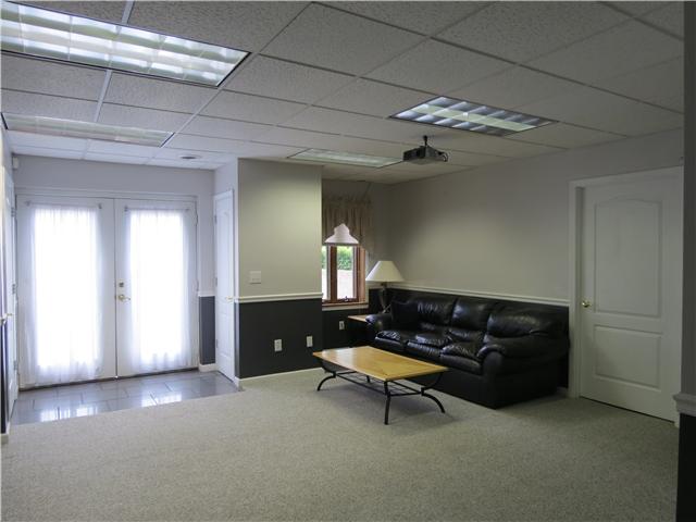2255 Thompson Road Murfreesboro, TN 37128 - Photo 11 of 20 a living room with furniture and a chandelier