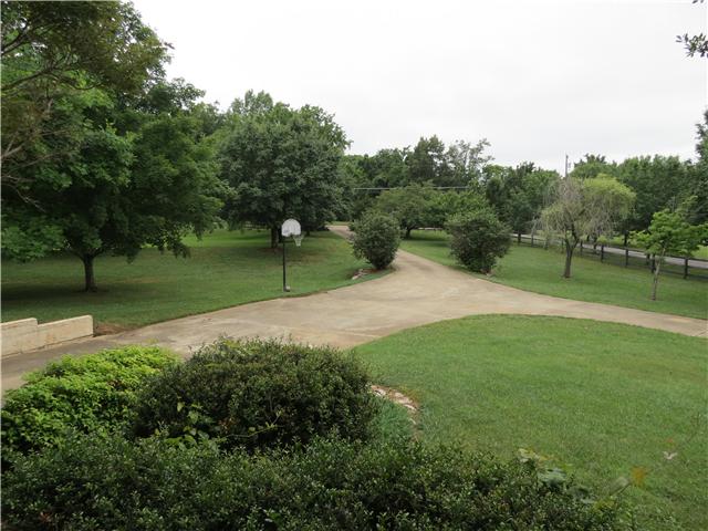 2255 Thompson Road Murfreesboro, TN 37128 - Photo 14 of 20 a view of outdoor space with green field and trees