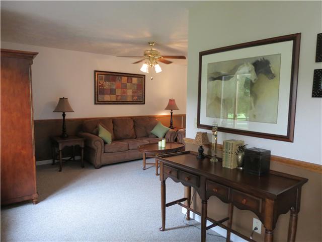 2255 Thompson Road Murfreesboro, TN 37128 - Photo 2 of 20 a living room with a couch and a table