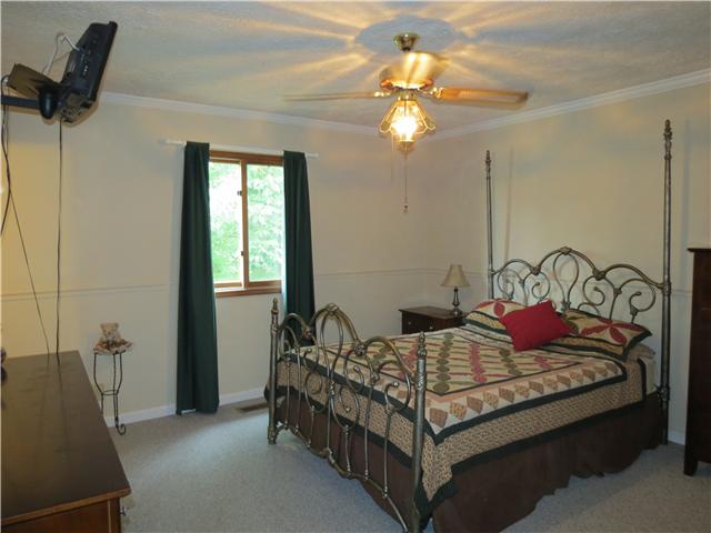 2255 Thompson Road Murfreesboro, TN 37128 - Photo 7 of 20 a bedroom with a bed and ceiling fan