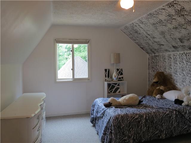 2255 Thompson Road Murfreesboro, TN 37128 - Photo 9 of 20 a bedroom with a bed and a window