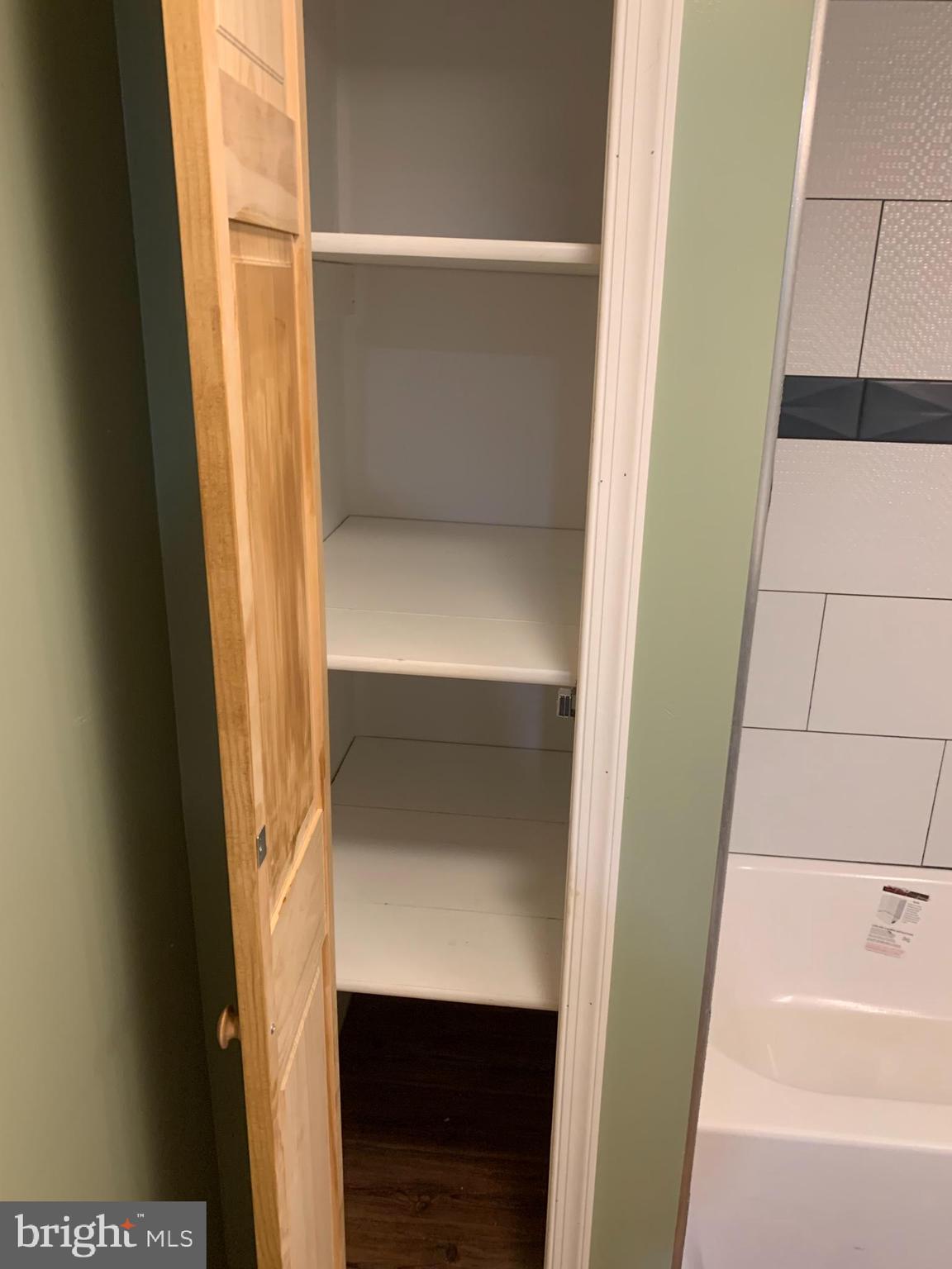 808 Dover Road Easton, MD 21601 - Photo 26 of 34 Upstairs lining closet in the bathroom