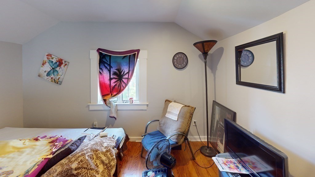 10 Sachem Road Weymouth, MA 02191 - Photo 11 of 19 a bedroom with a bed and painting on the wall