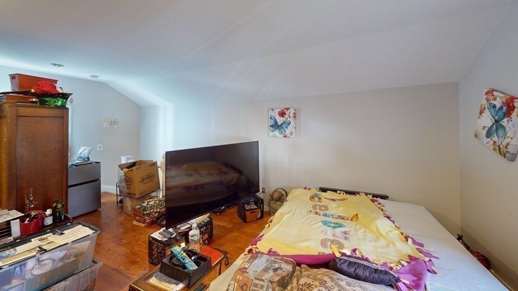 10 Sachem Road Weymouth, MA 02191 - Photo 12 of 19 a bedroom with a bed and flat screen tv