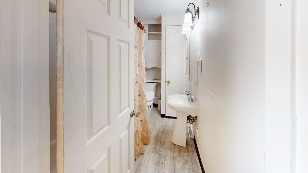 10 Sachem Road Weymouth, MA 02191 - Photo 10 of 19 a bathroom with a sink and toilet