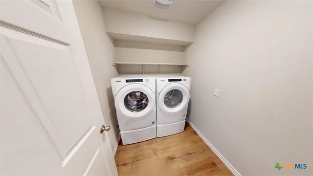 a bathroom with a granite countertop sink a mirror and a toilet