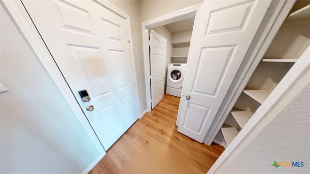 a bathroom with a granite countertop sink a mirror and shower