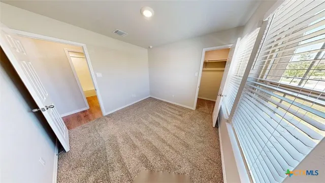 a view of a room with white walls