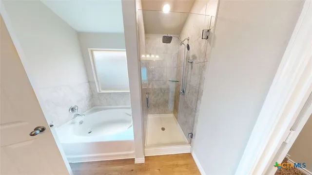 a view of living room with furniture and wooden floor