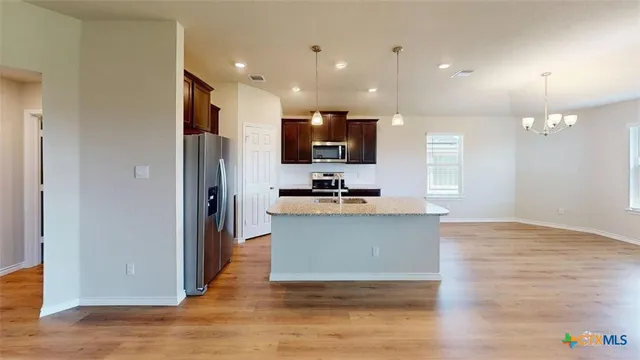 a view of a living room with a wooden floor