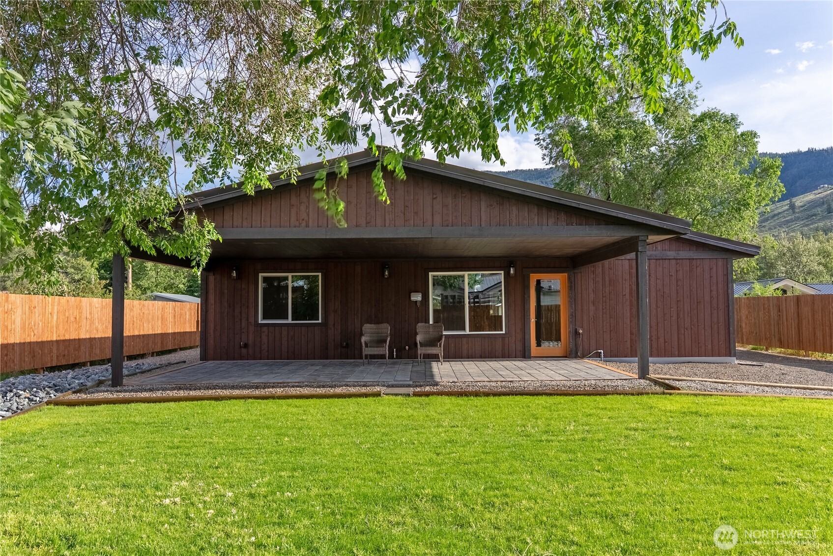 1110 Riverside Avenue Twisp, WA 98856 - Photo 27 of 28 a front view of house with yard and outdoor seating