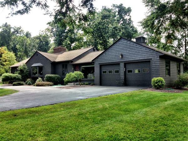 10 Colonial Road Wilbraham, MA 01095 - Photo 1 of 22 a front view of a house with a garden and yard