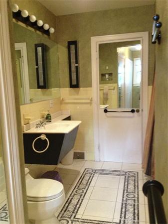 10 Colonial Road Wilbraham, MA 01095 - Photo 17 of 22 a bathroom with a toilet a sink and mirror