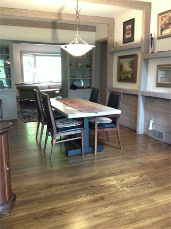 10 Colonial Road Wilbraham, MA 01095 - Photo 10 of 22 a dining room with wooden floor a chandelier a wooden table and chairs