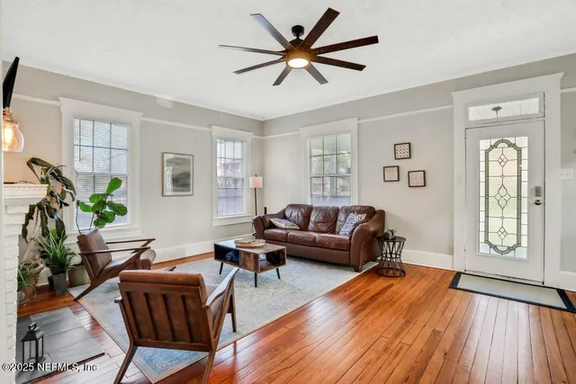 a living room with furniture and a window