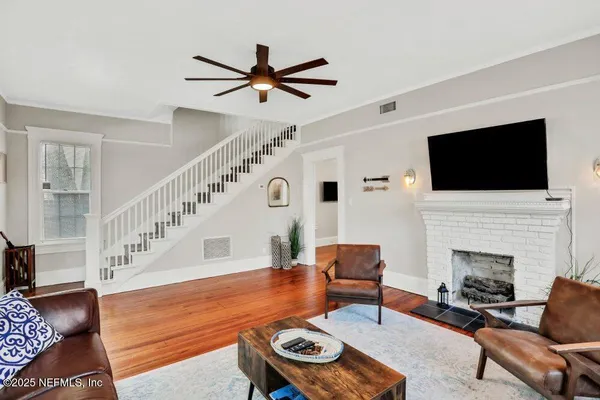 a living room with furniture and a flat screen tv