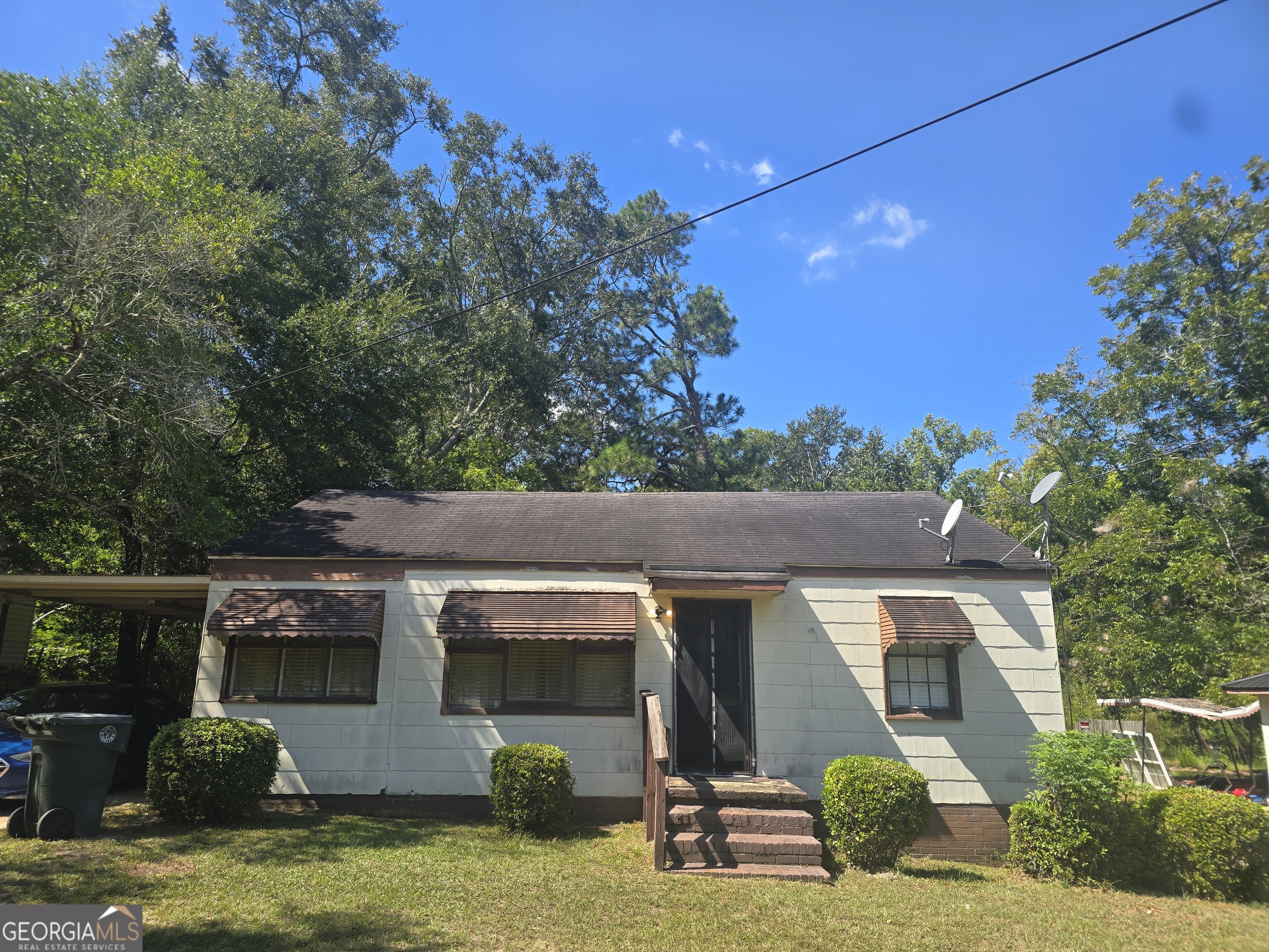 a view of house with yard entertaining space and outdoor seating