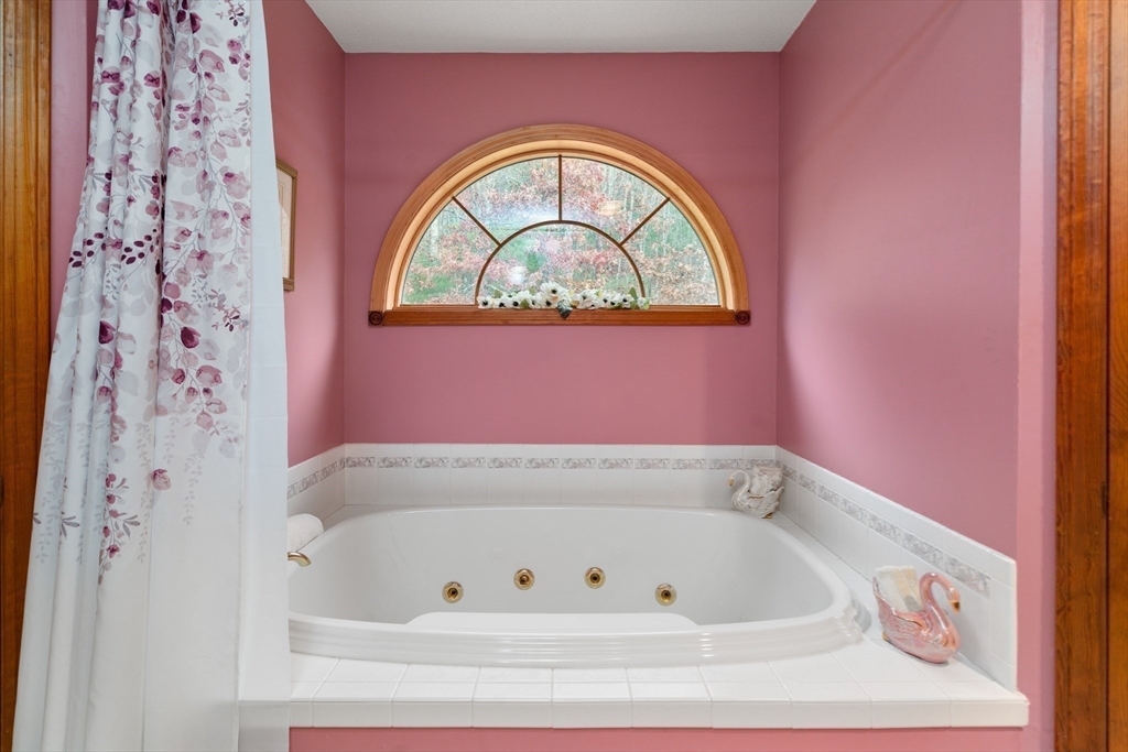 15 Sturbridge Road Brimfield, MA 01010 - Photo 12 of 36 a bathroom with a bathtub and a window