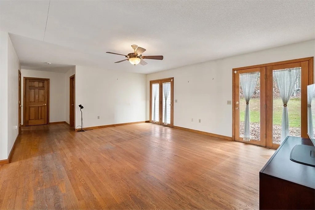 15 Sturbridge Road Brimfield, MA 01010 - Photo 3 of 36 a view of an empty room with a window and wooden floor