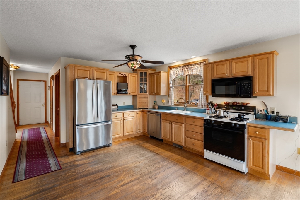 15 Sturbridge Road Brimfield, MA 01010 - Photo 5 of 36 a kitchen with granite countertop a refrigerator stove top oven and sink