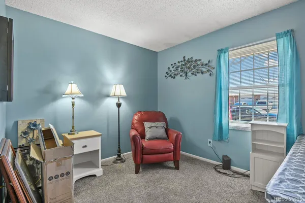 a room with furniture and a window