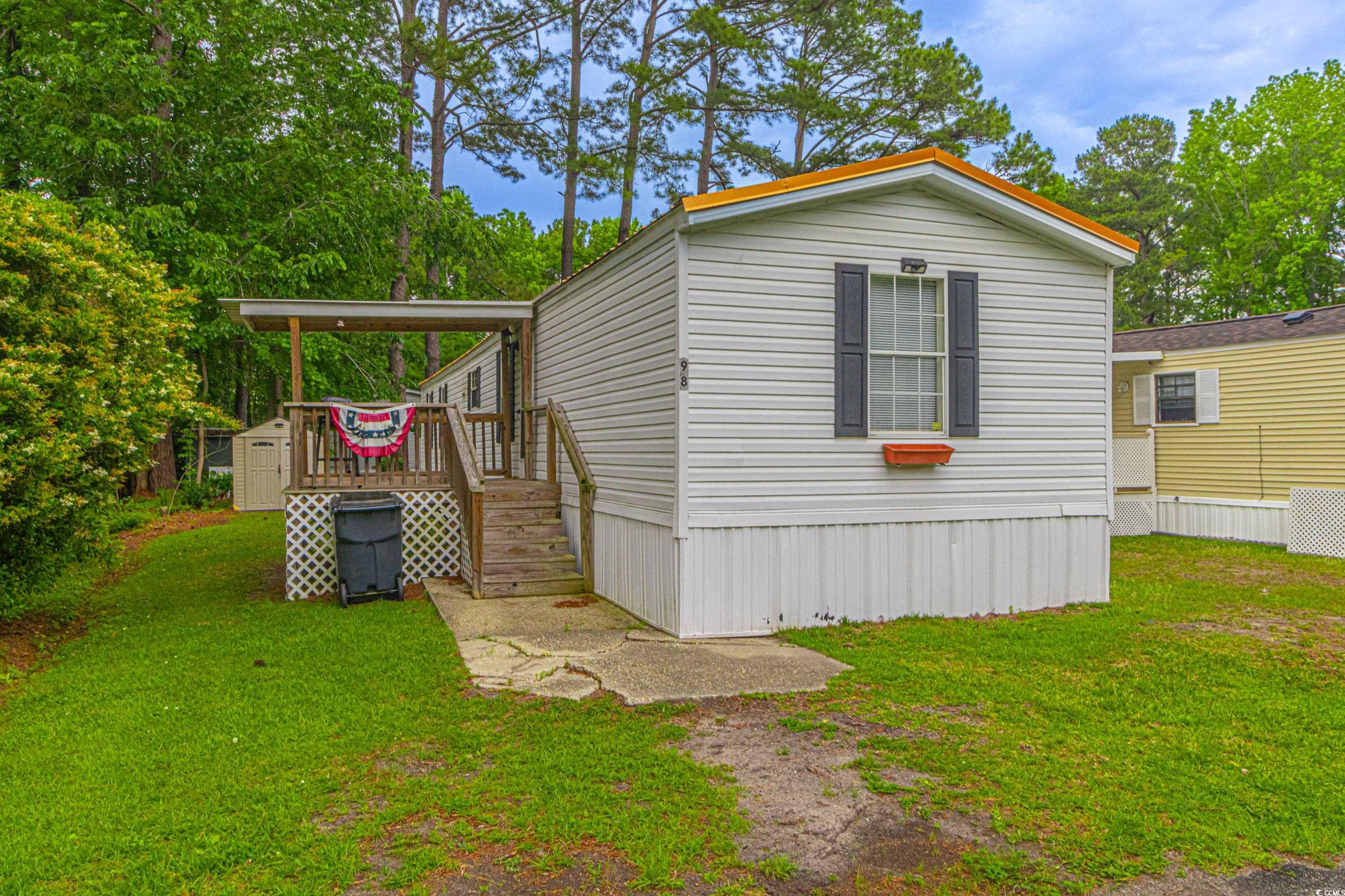 98 Offshore Drive Murrells Inlet, SC 29576 - Photo 1 of 27 View of home's exterior with a yard and a deck