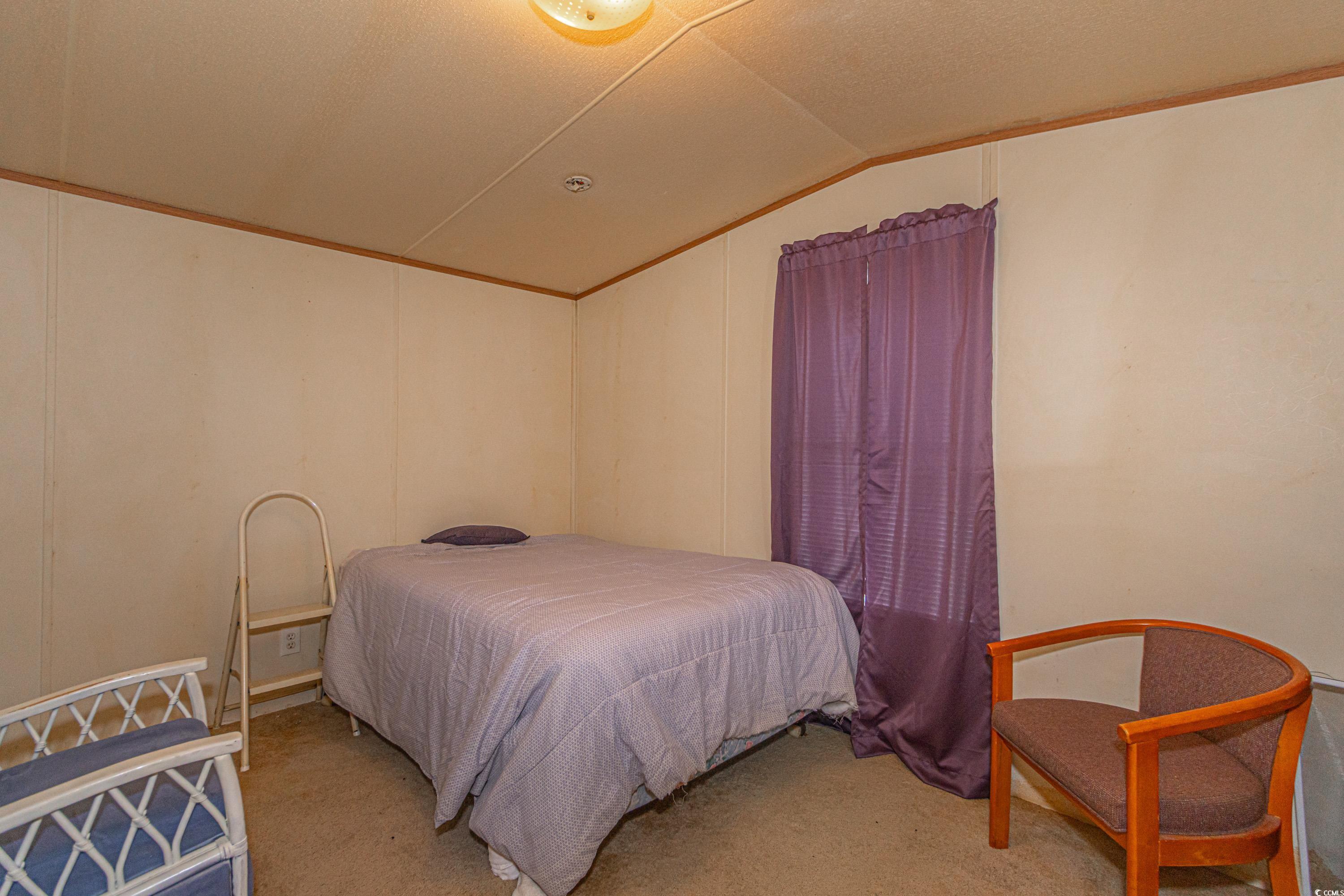 98 Offshore Drive Murrells Inlet, SC 29576 - Photo 16 of 27 Bedroom featuring vaulted ceiling and light colore