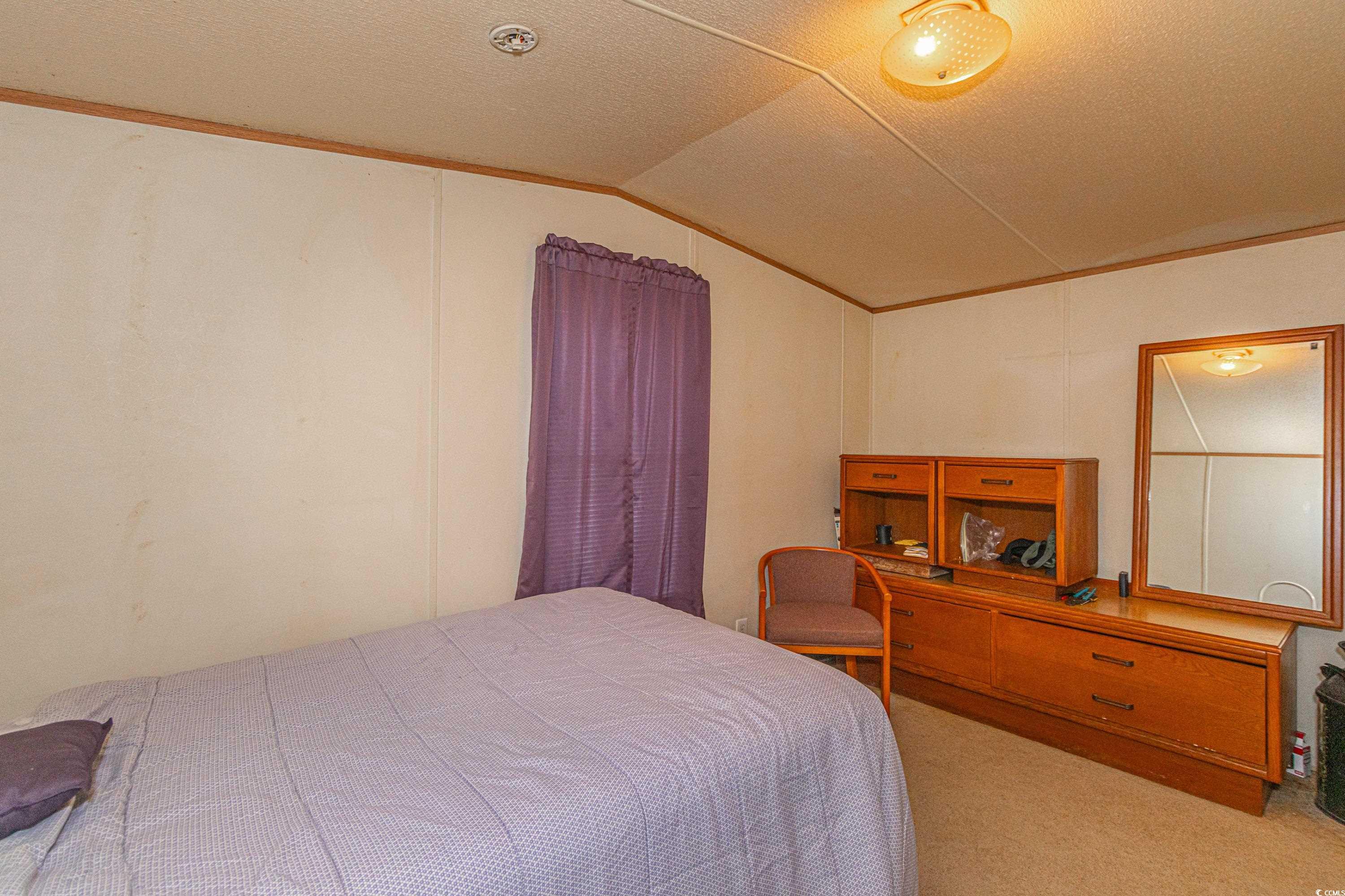 98 Offshore Drive Murrells Inlet, SC 29576 - Photo 17 of 27 Carpeted bedroom with vaulted ceiling