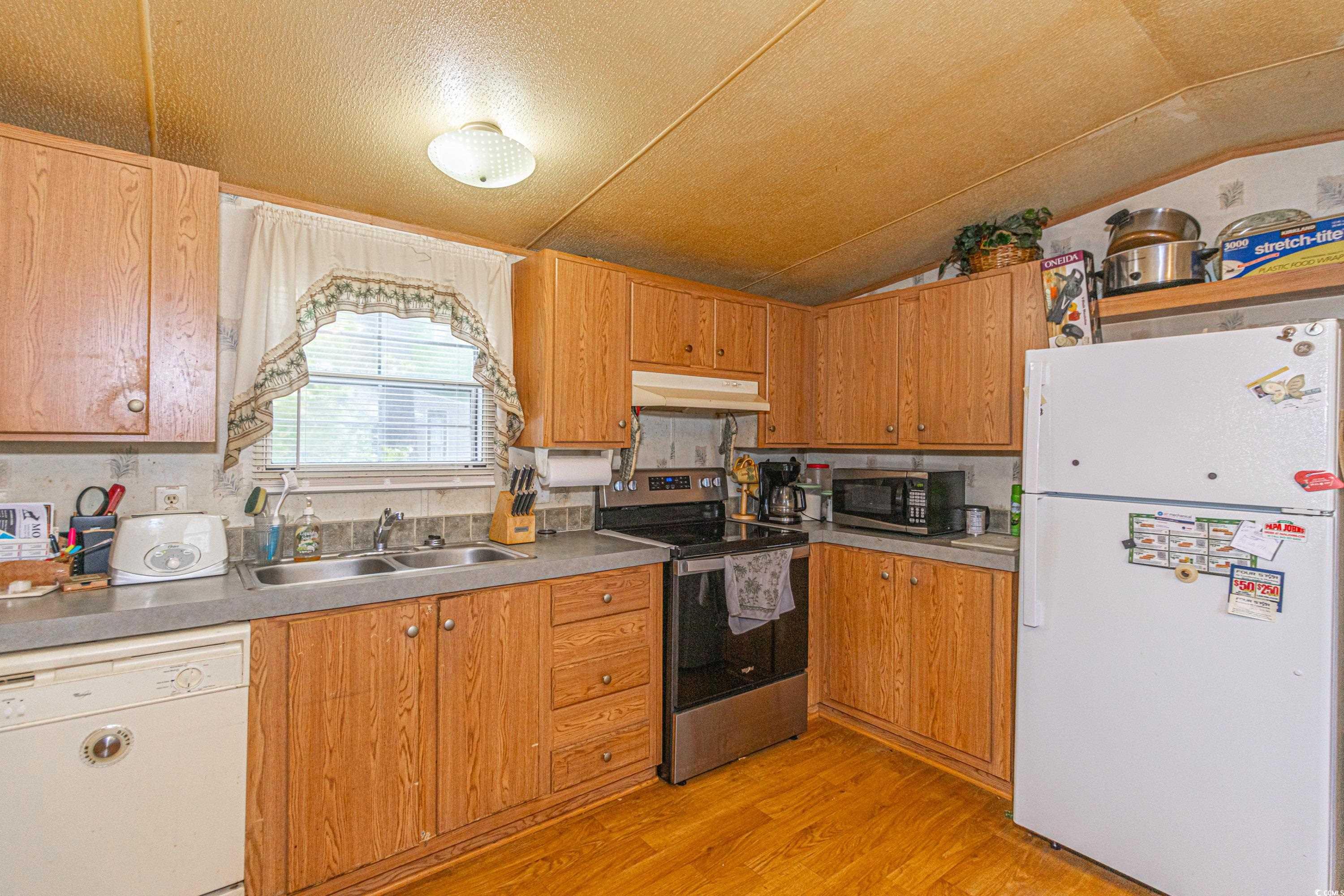 98 Offshore Drive Murrells Inlet, SC 29576 - Photo 20 of 27 Kitchen featuring stainless steel appliances, a si