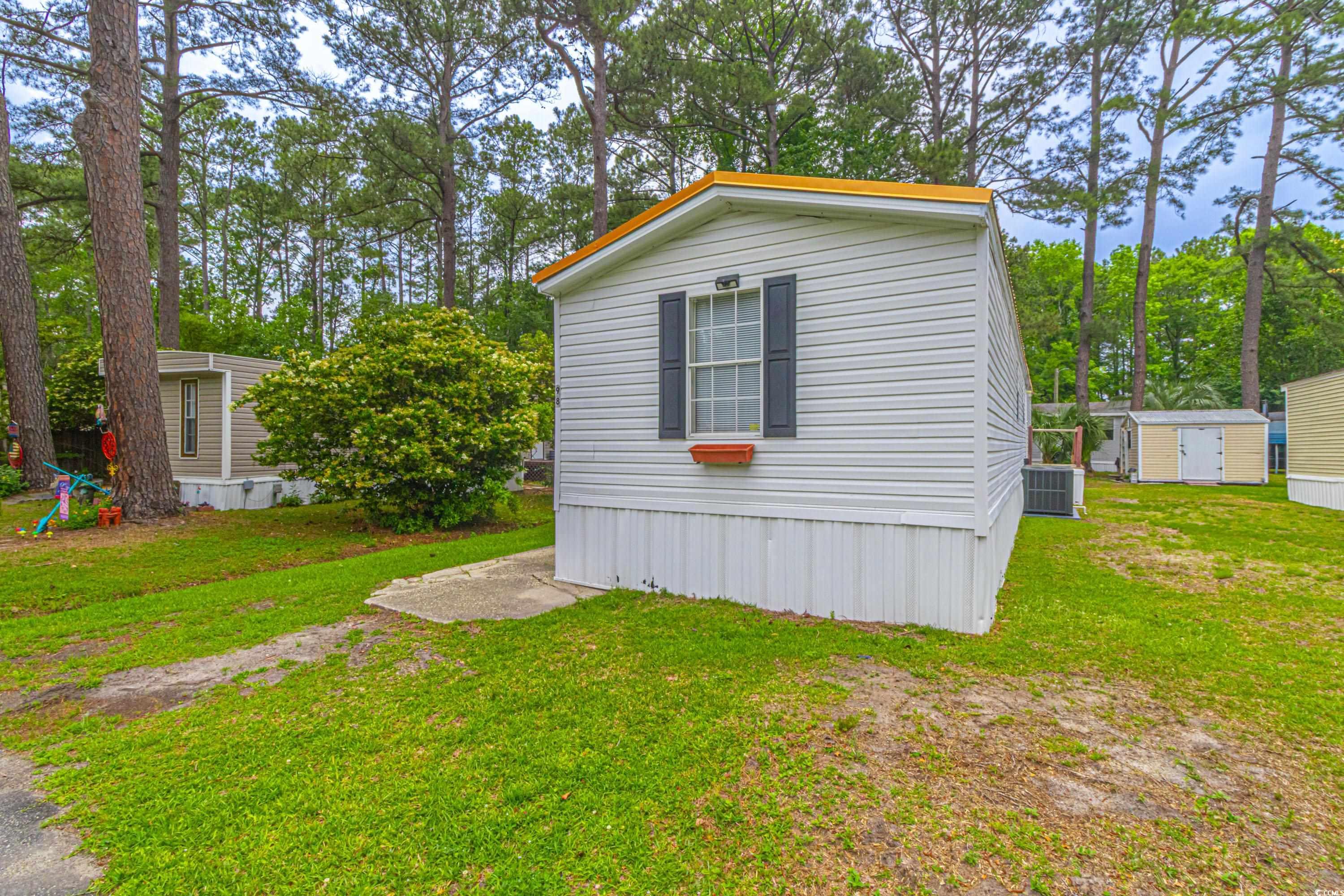 98 Offshore Drive Murrells Inlet, SC 29576 - Photo 25 of 27 View of shed with central AC unit