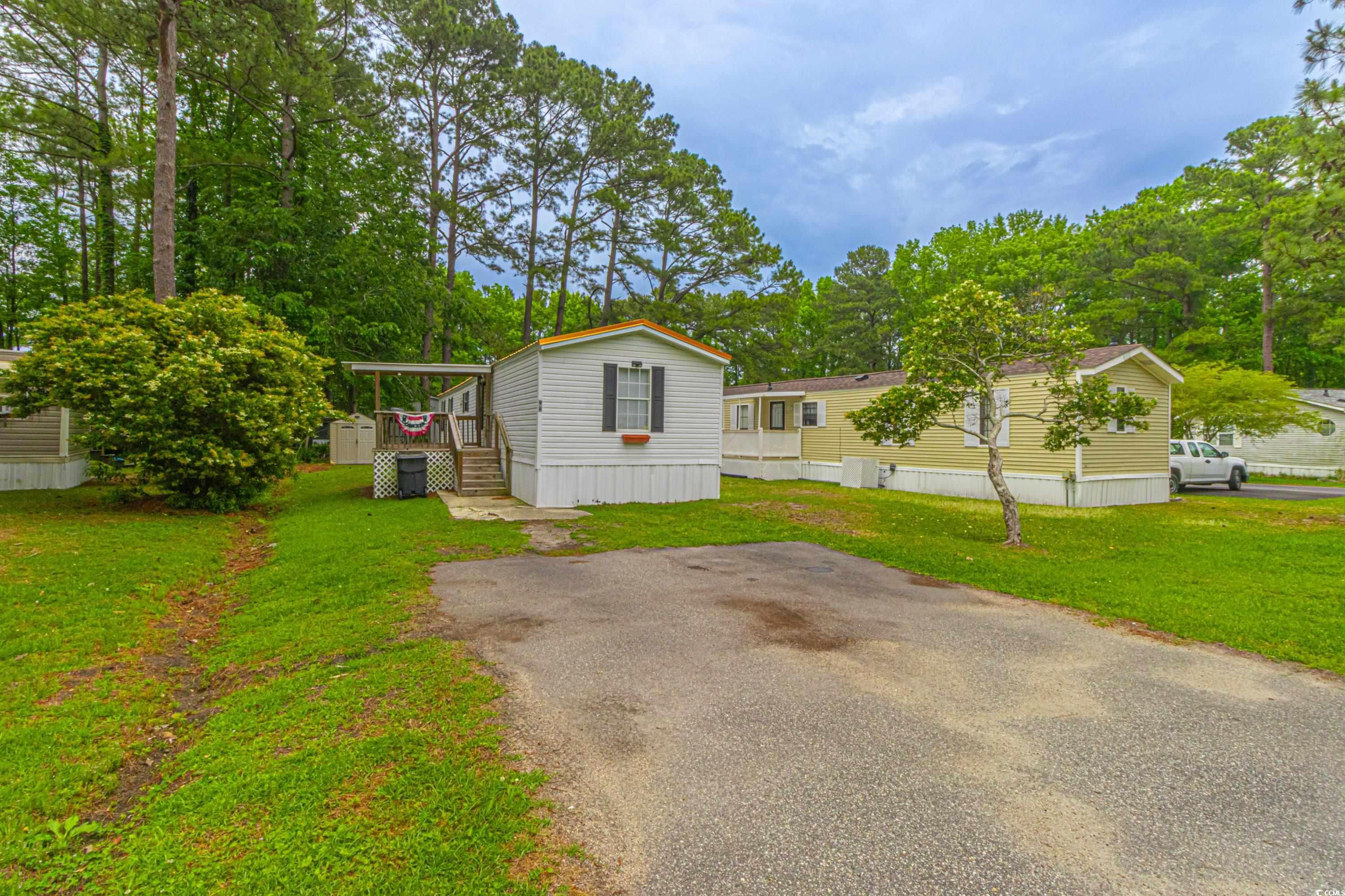 98 Offshore Drive Murrells Inlet, SC 29576 - Photo 26 of 27 Manufactured / mobile home featuring a front yard