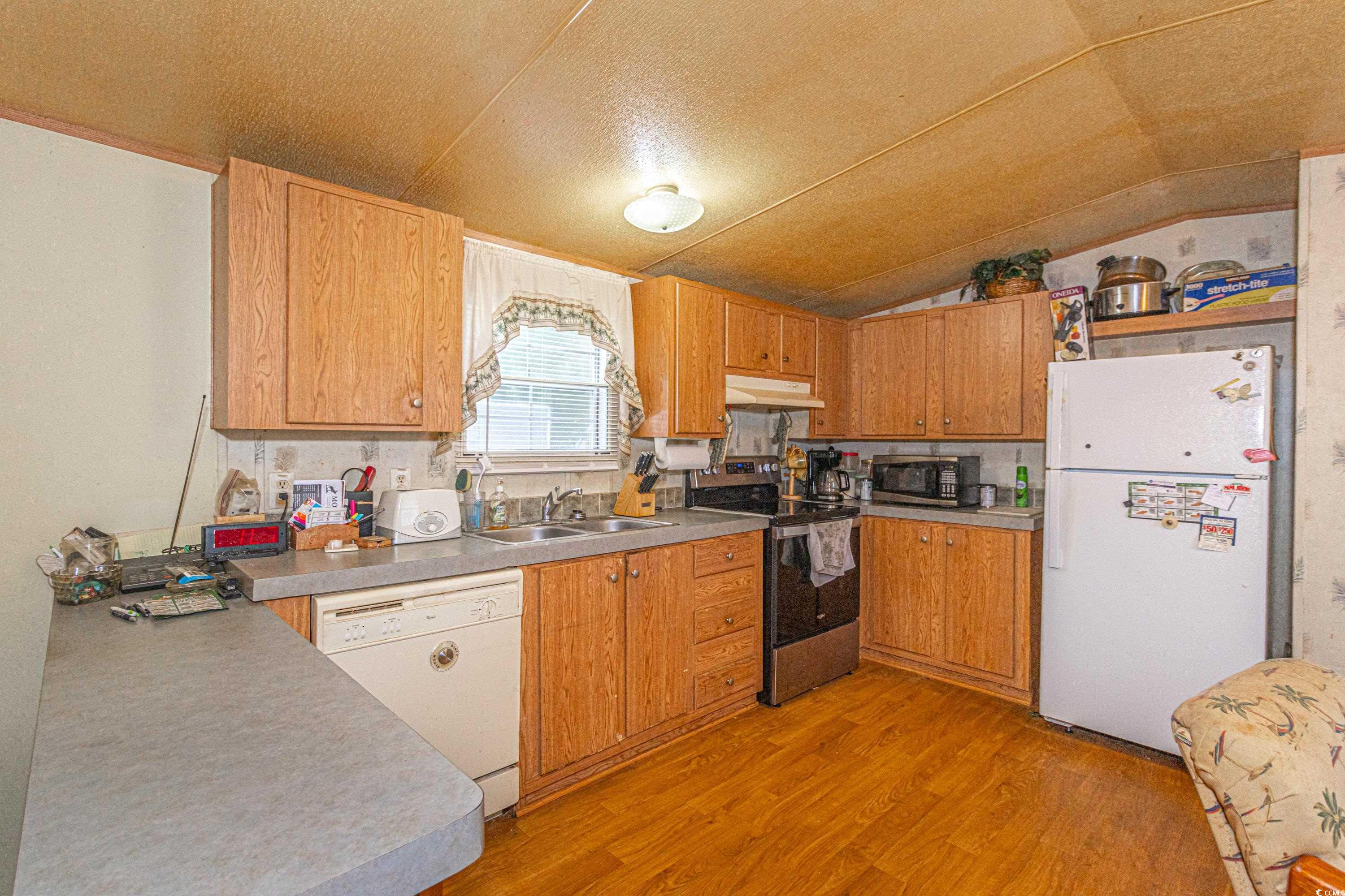 98 Offshore Drive Murrells Inlet, SC 29576 - Photo 6 of 27 Kitchen with stainless steel appliances, under cab